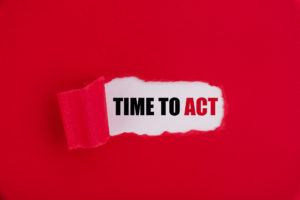 The text Time to act appearing behind torn red paper.