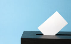 ballot box with voting paper in hole
