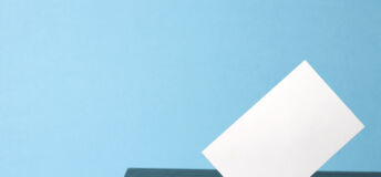 ballot box with voting paper in hole