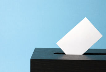 ballot box with voting paper in hole