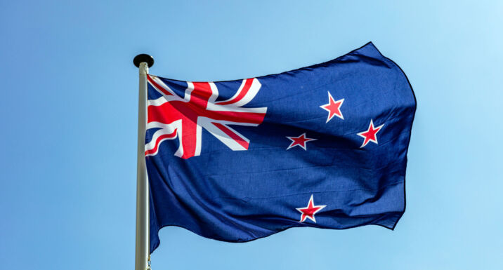 NZ Super updates human rights policy after losing lawsuit New Zealand flag, New Zealand national symbol waving against clear blue sky, sunny day