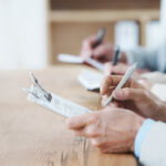 Review of EU shareholder rights law must end national fragmentation, say stakeholders Cropped shot of three coworkers sitting at a table and taking notes