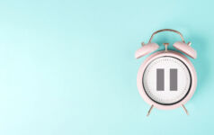 Alarm clock with pause sign, take a break, menopause concept, hormone replacement therapy