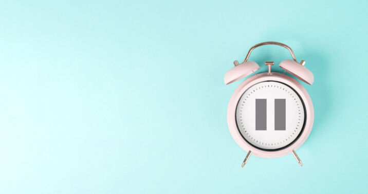 Alarm clock with pautilize sign, take a break, menopautilize concept, hormone replacement therapy Alarm clock with pautilize sign, take a break, menopautilize concept, hormone replacement therapy