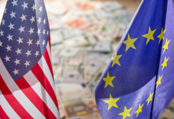 US Dollar and Euro on flags of the United States and European Union.