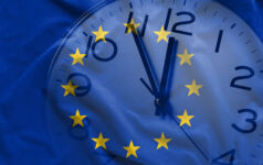 Double exposure of clock and blue flag of European Union