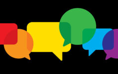 Vector illustration of multi-colored speech bubbles against a black background in flat style.