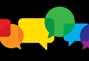 Vector illustration of multi-colored speech bubbles against a black background in flat style.