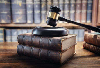 US Republicans target Big Four auditors over ‘climate activism’ Judge gavel and law books in court, law and justice background concept