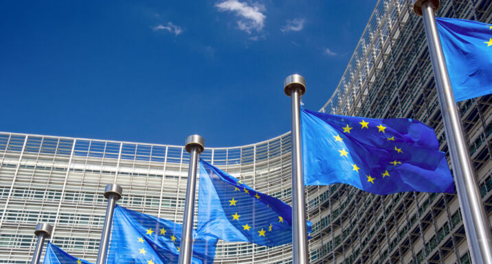 Spain moots new SFDR eligibility pathway for sovereign bonds EU flags near of European Commission building