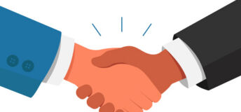two people shaking hands (just hands are visible)