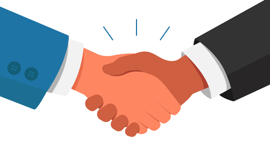 two people shaking hands (just hands are visible)