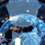 Image of shaking hands behind a globe.