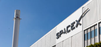 The Headquarters of SpaceX in Hawthorne, California, with a Falcon 9 booster in March 2024.