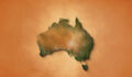 The video showcases an animation of a realistic map of Australia set against a brown vintage paper background. It utilizes a zooming effect, allowing viewers to closely examine the continent, revealing its geographical features and details.