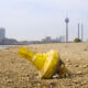 Low stream gauge of rhine river.Water shortage, drought, climate change,global warming concept, dry river bed with skyline of the town of düsseldorf, germany in the background